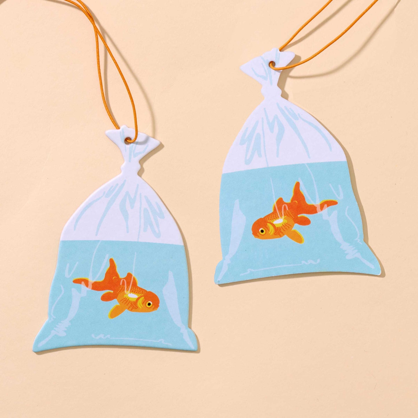 And Here We Are - Air Freshener—Goldfish in Bag—Rain Scent (Circus, Fun Gift) - PMA Store at the Portland Museum of Art, Maine