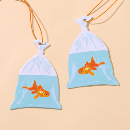 And Here We Are - Air Freshener—Goldfish in Bag—Rain Scent (Circus, Fun Gift) - PMA Store at the Portland Museum of Art, Maine