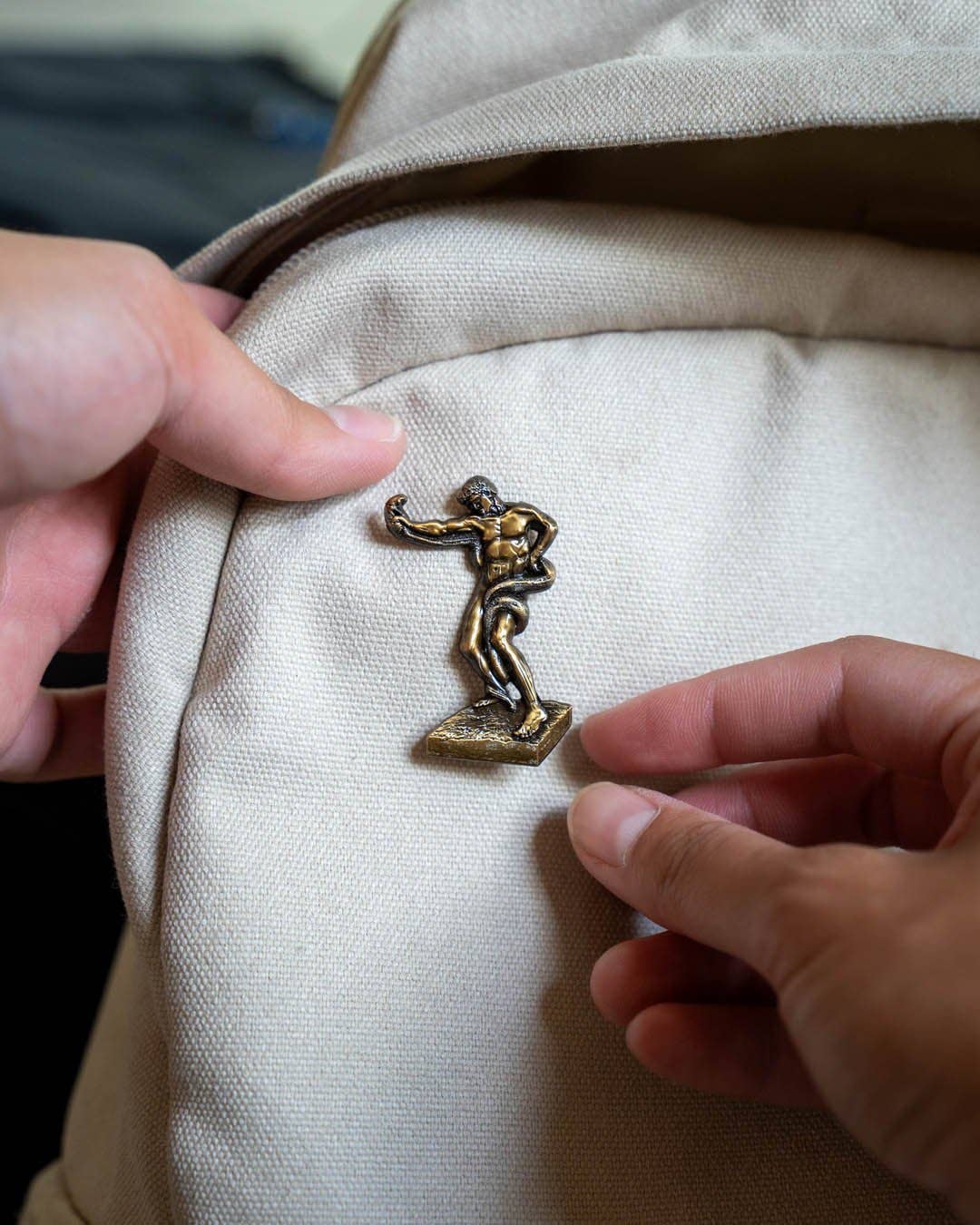 An Athlete Wrestling with a Python • Enamel Pin - PMA Store at the Portland Museum of Art, Maine