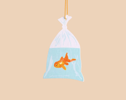 And Here We Are - Air Freshener—Goldfish in Bag—Rain Scent (Circus, Fun Gift) - PMA Store at the Portland Museum of Art, Maine